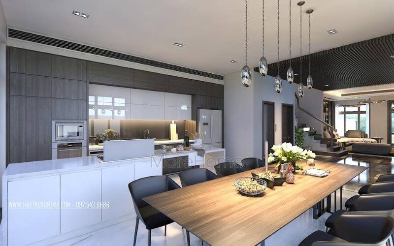 Bố trí nội thất phòng ăn liền bếp hiện đại, sang trọng từ tủ bếp đảo kết hợp đá ốp cao cấp cùng bộ bàn ghế ăn gỗ nguyên tấm độc đáo.